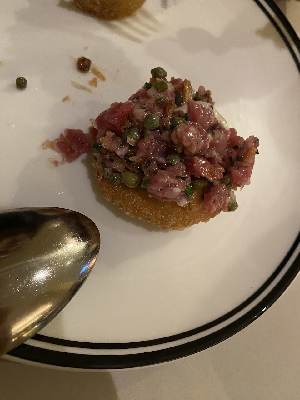 Beef crudo served on a crisp base